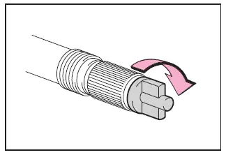 Subaru Solterra securing hose cap after completing tire repair process